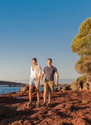 Couple bush walking in Ben Boyd National Park Eden